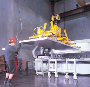 Operator Fred Cadassa loads a 3” thick sheet of aluminum in to a Metl Saw plate saw. The plate saw has a capacity of slicing plate up to 12” thick by 12’ x 12’ with an accuracy of ± .005”. Including this one, Dix Metals operates 7 high-precision plate saws. 